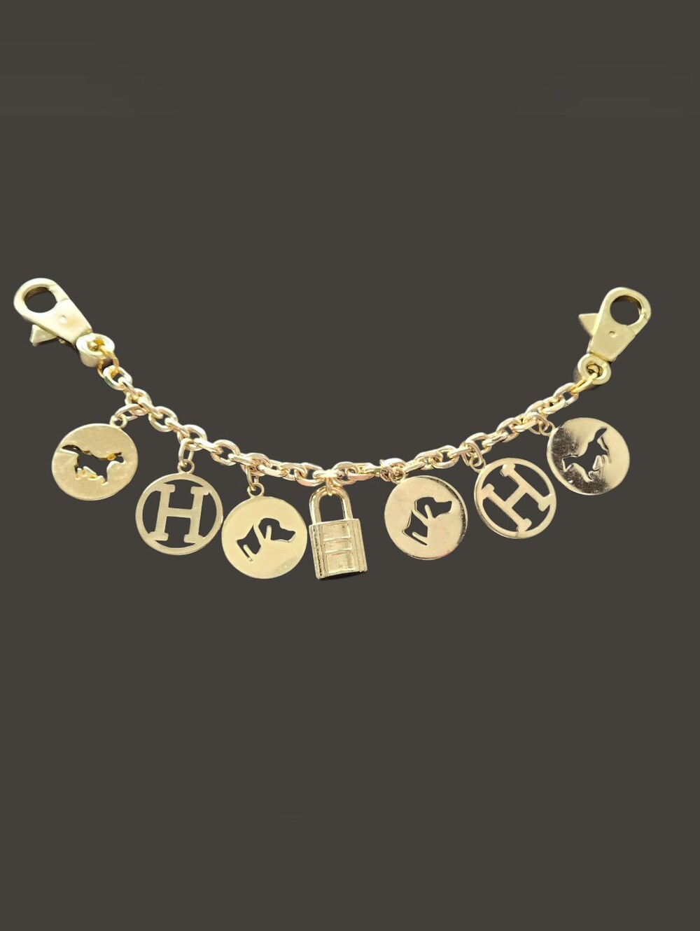 H Gold Tone Bag Charm with Animal and Lock NWOT
